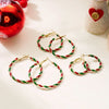 Peppermint Twist Hoop Earrings - Chunky twisted metal hoop earrings with alternating red and green enamel paint, making them look like candy canes.