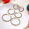 Peppermint Twist Hoop Earrings - Chunky twisted metal hoop earrings with alternating red and green enamel paint, making them look like candy canes.