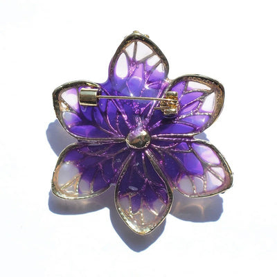 Isabelle Iris Sculpted Resin Brooch - An elegant floral brooch available in green, purple, or salmon pink, with shimmering crystals and semi-translucent resin.