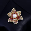 Isabelle Iris Sculpted Resin Brooch - An elegant floral brooch available in green, purple, or salmon pink, with shimmering crystals and semi-translucent resin.