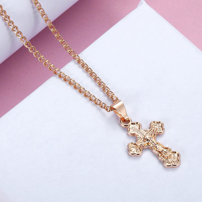 Piety Small Ornate Crucifix Necklace - A small, elegant rose gold ornate crucifix on a matching double-link chain.