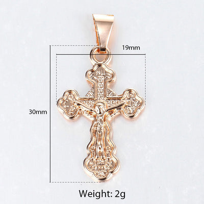 Piety Small Ornate Crucifix Necklace - A small, elegant rose gold ornate crucifix on a matching double-link chain.