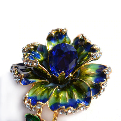 Piper Enamel Primrose Brooch - A detailed floral brooch featuring a large central stone with ruffled enamel petals surrounding it, painted with vibrant enamel paint.