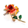 Piper Enamel Primrose Brooch - A detailed floral brooch featuring a large central stone with ruffled enamel petals surrounding it, painted with vibrant enamel paint.