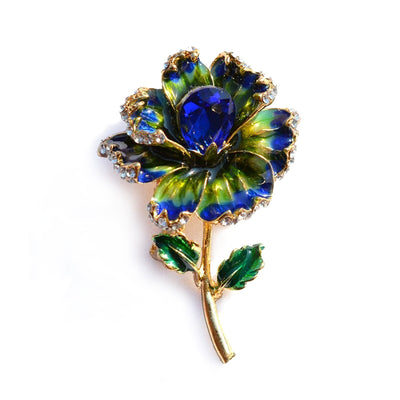 Piper Enamel Primrose Brooch - A detailed floral brooch featuring a large central stone with ruffled enamel petals surrounding it, painted with vibrant enamel paint.