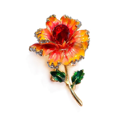 Piper Enamel Primrose Brooch - A detailed floral brooch featuring a large central stone with ruffled enamel petals surrounding it, painted with vibrant enamel paint.