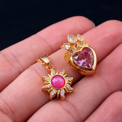 Pretty Pretty Princess Royal Heart & Sun Necklace Set - A delicate jewellery set featuring a matched pair of necklaces with pink crystals and gold-toned metal.