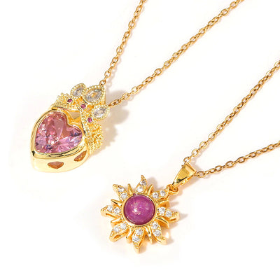 Pretty Pretty Princess Royal Heart & Sun Necklace Set - A delicate jewellery set featuring a matched pair of necklaces with pink crystals and gold-toned metal.