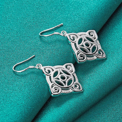 Quetzlali Geometric Drop Earrings - Beautiful silver earrings featuring a cool, unusual geometric motif formed by squares, curves, and spirals.