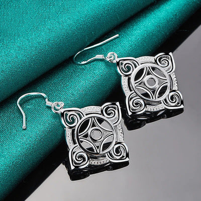 Quetzlali Geometric Drop Earrings - Beautiful silver earrings featuring a cool, unusual geometric motif formed by squares, curves, and spirals.