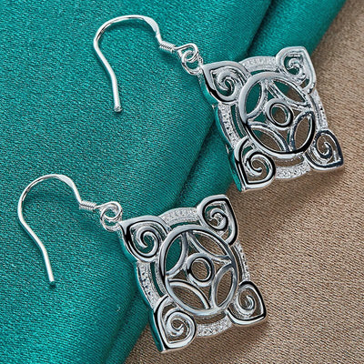 Quetzlali Geometric Drop Earrings - Beautiful silver earrings featuring a cool, unusual geometric motif formed by squares, curves, and spirals.