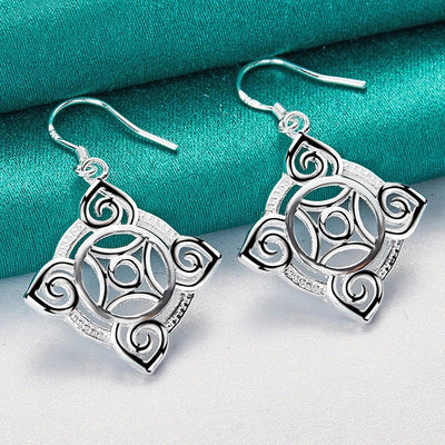 Quetzlali Geometric Drop Earrings - Beautiful silver earrings featuring a cool, unusual geometric motif formed by squares, curves, and spirals.