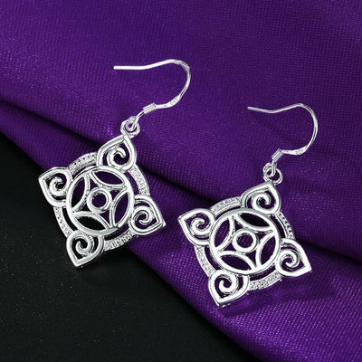 Quetzlali Geometric Drop Earrings - Beautiful silver earrings featuring a cool, unusual geometric motif formed by squares, curves, and spirals.