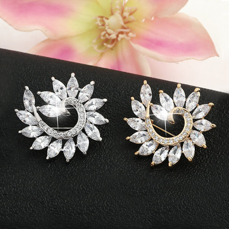 Radiance Luxury Crystal Fibonacci Brooch - A lovely sparkling crystal brooch featuring a dramatic spiral shape reminiscent of the classic Fibonacci spiral.