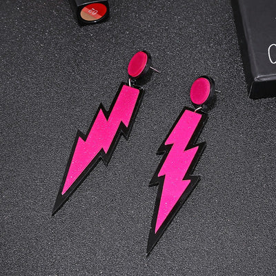 Retro Revival Bolt Outta The Lobe Post Earrings - Large, colourful lightning bolt earrings made from vivid acrylic plastic, with a black background that looks like the outline of a comic book character.