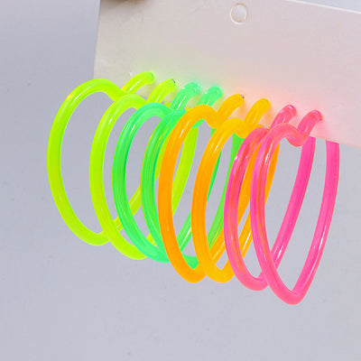 Neon Vibes Oversized Heart Hoop Earrings - Large, chunky heart-shaped acrylic hoop earrings, available in Neon Green, Orange, Pink, or Yellow.
