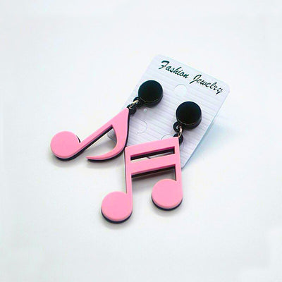 Retro Revival Notable Notes Earrings - Large asymmetrical acrylic earrings shaped like oversized musical notes, created from stylized pink, white, or black acrylic.