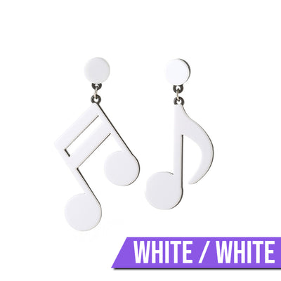 Retro Revival Notable Notes Earrings - Large asymmetrical acrylic earrings shaped like oversized musical notes, created from stylized pink, white, or black acrylic.