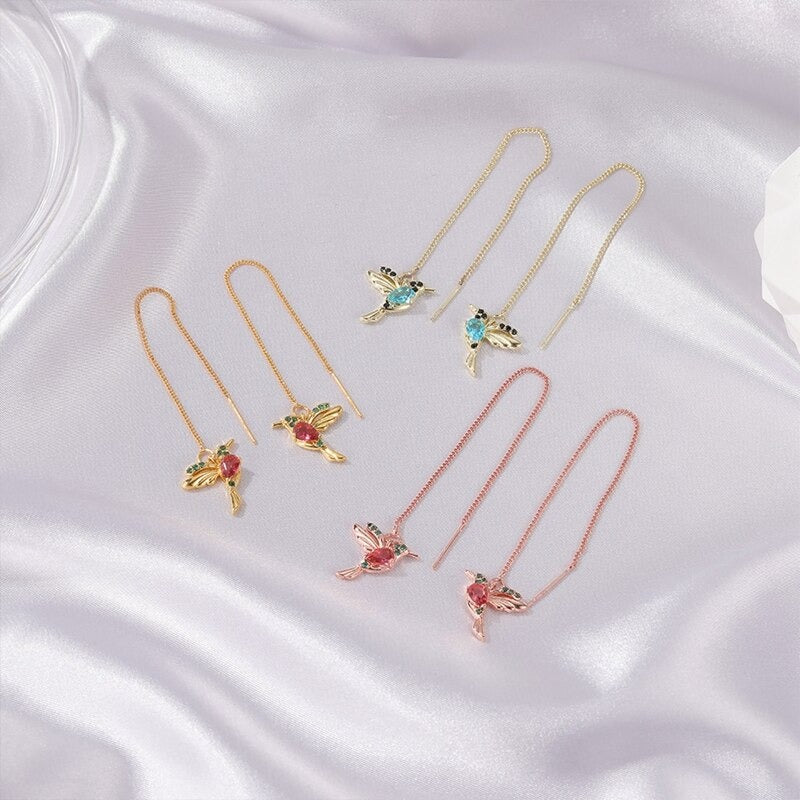 Rhiannon Hummingbird Threader Earrings - Tiny bird-shaped charms adorned with colourful crystals, attached to a long threader earring chain.