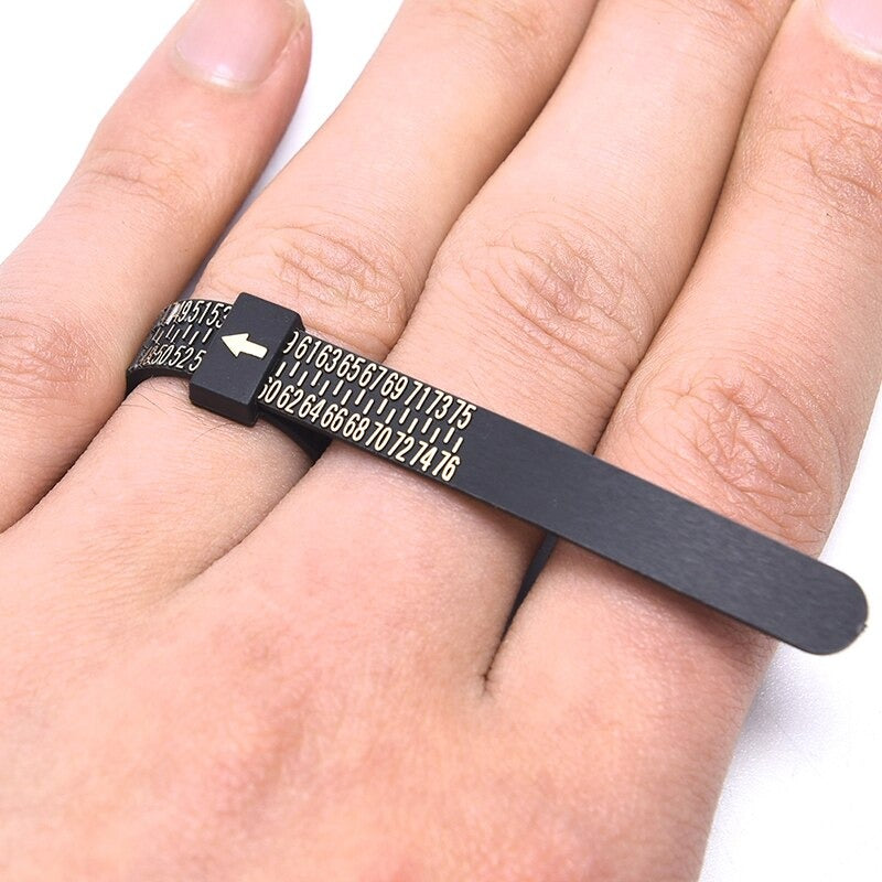 Ring Sizing Belts - A black plastic ring sizing belt with gold text.