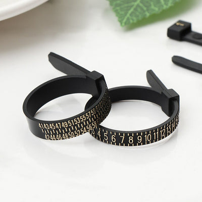 Ring Sizing Belts - A black plastic ring sizing belt with gold text.