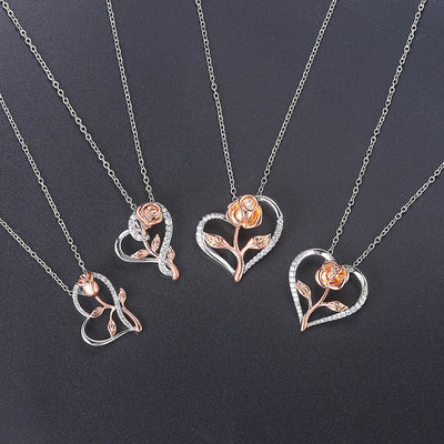 Rosalie Rosebud Heart Necklace - An elegant floral-themed necklace featuring a platinum plated heart with a beautiful rose gold rose, and sparkling crystals.