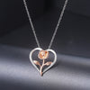 Rosalie Rosebud Heart Necklace - An elegant floral-themed necklace featuring a platinum plated heart with a beautiful rose gold rose, and sparkling crystals.