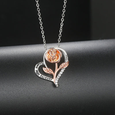 Rosalie Rosebud Heart Necklace - An elegant floral-themed necklace featuring a platinum plated heart with a beautiful rose gold rose, and sparkling crystals.