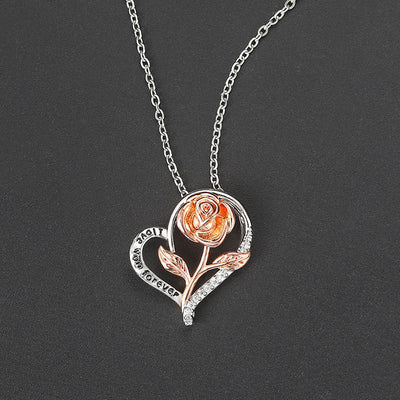 Rosalie Rosebud Heart Necklace - An elegant floral-themed necklace featuring a platinum plated heart with a beautiful rose gold rose, and sparkling crystals.