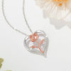 Rosalie Rosebud Heart Necklace - An elegant floral-themed necklace featuring a platinum plated heart with a beautiful rose gold rose, and sparkling crystals.