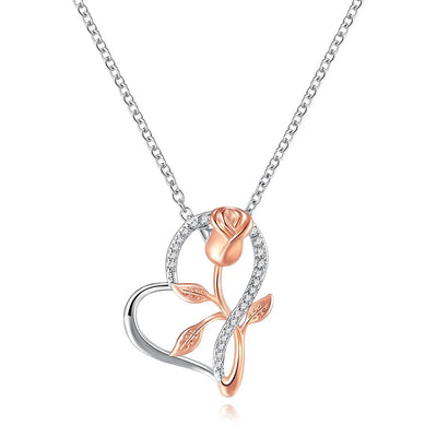 Rosalie Rosebud Heart Necklace - An elegant floral-themed necklace featuring a platinum plated heart with a beautiful rose gold rose, and sparkling crystals.