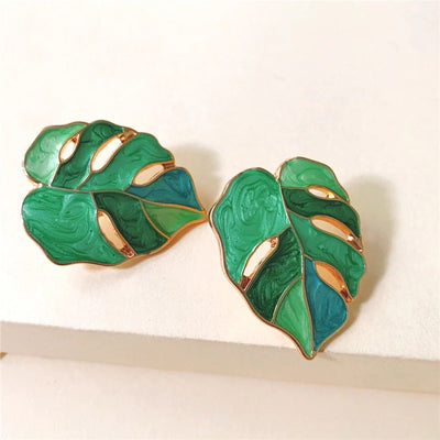 Salma Palm Leaf Enamel Earrings - Large enamel earrings with stylised leaves painted in complimentary shades of enamel paint.