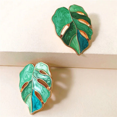 Salma Palm Leaf Enamel Earrings - Large enamel earrings with stylised leaves painted in complimentary shades of enamel paint.