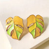 Salma Palm Leaf Enamel Earrings - Large enamel earrings with stylised leaves painted in complimentary shades of enamel paint.