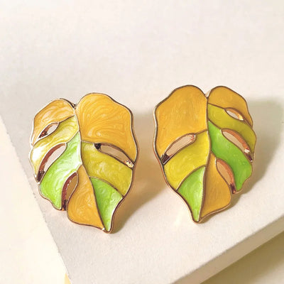 Salma Palm Leaf Enamel Earrings - Large enamel earrings with stylised leaves painted in complimentary shades of enamel paint.