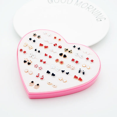 The Sassy Fash Children's Earring Set - an assortment of silicone-stemmed hypoallergenic earrings in a cute heart-shaped box.