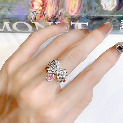 Selena Adjustable Statement Ring - This ring screams both quality and style, with an elegant multi-strand bow that sits on your finger while a soft, pear-shaped pink stone dances around with your movements.