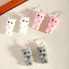 Selina Flocked Velvet Kitten Drop Earrings - Adorable little fuzzy humanoid kitty cat charms suspended from a French hook, available in your choice of grey, white, or pink.