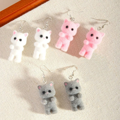 Selina Flocked Velvet Kitten Drop Earrings - Adorable little fuzzy humanoid kitty cat charms suspended from a French hook, available in your choice of grey, white, or pink.