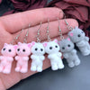 Selina Flocked Velvet Kitten Drop Earrings - Adorable little fuzzy humanoid kitty cat charms suspended from a French hook, available in your choice of grey, white, or pink.