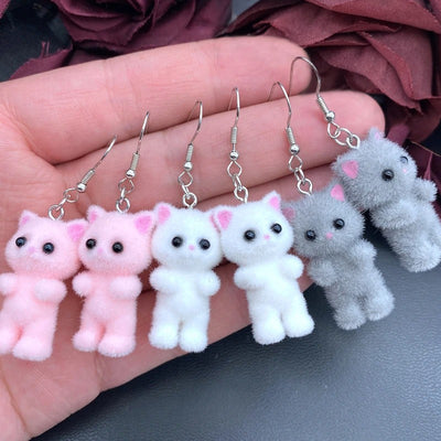 Selina Flocked Velvet Kitten Drop Earrings - Adorable little fuzzy humanoid kitty cat charms suspended from a French hook, available in your choice of grey, white, or pink.