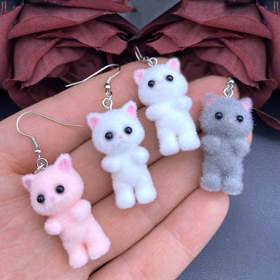 Selina Flocked Velvet Kitten Drop Earrings - Adorable little fuzzy humanoid kitty cat charms suspended from a French hook, available in your choice of grey, white, or pink.