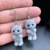 Selina Flocked Velvet Kitten Drop Earrings - Adorable little fuzzy humanoid kitty cat charms suspended from a French hook, available in your choice of grey, white, or pink.