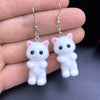 Selina Flocked Velvet Kitten Drop Earrings - Adorable little fuzzy humanoid kitty cat charms suspended from a French hook, available in your choice of grey, white, or pink.