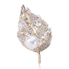 Sian Crystal Leaf Brooch - A medium-sized brooch shaped like a leaf, studded with assorted round and marquise cut crystals, and a pearl.