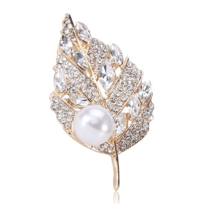 Sian Crystal Leaf Brooch - A medium-sized brooch shaped like a leaf, studded with assorted round and marquise cut crystals, and a pearl.