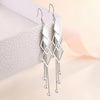 Sienna Dancing Threads Dangle Earrings - Lovely sterling silver earrings featuring interlocking diamonds and long elegant strands.