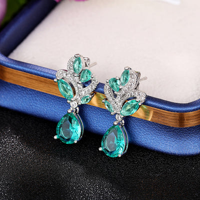 Siobhan Seafoam Spray Crystal Drop Earrings - Tiny, delicate, classic drop earrings featuring an assortment of pear-cut blue-green stones surrounded by tiny round cut quartz.