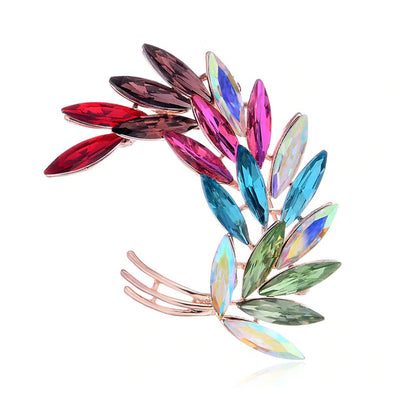Sitaria Crystal Curved Grain Brooch - An elegant crystal brooch crafted from an assortment of marquise cut crystals arranged to look like heads of grain, in either a golden champagne colour or a rainbow gradient.