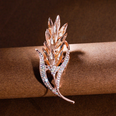 Sitaria Crystal Straight Grain Brooch - An elegant crystal brooch crafted from an assortment of marquise cut crystals arranged to look like heads of grain, in either a golden champagne colour or a rainbow gradient.